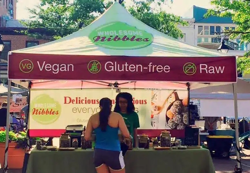 The Wholesome Nibbles stand at a farmers market